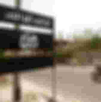 An al-Qaeda logo is seen on a street sign in the town of Jaar in southern Abyan province, Yemen.
