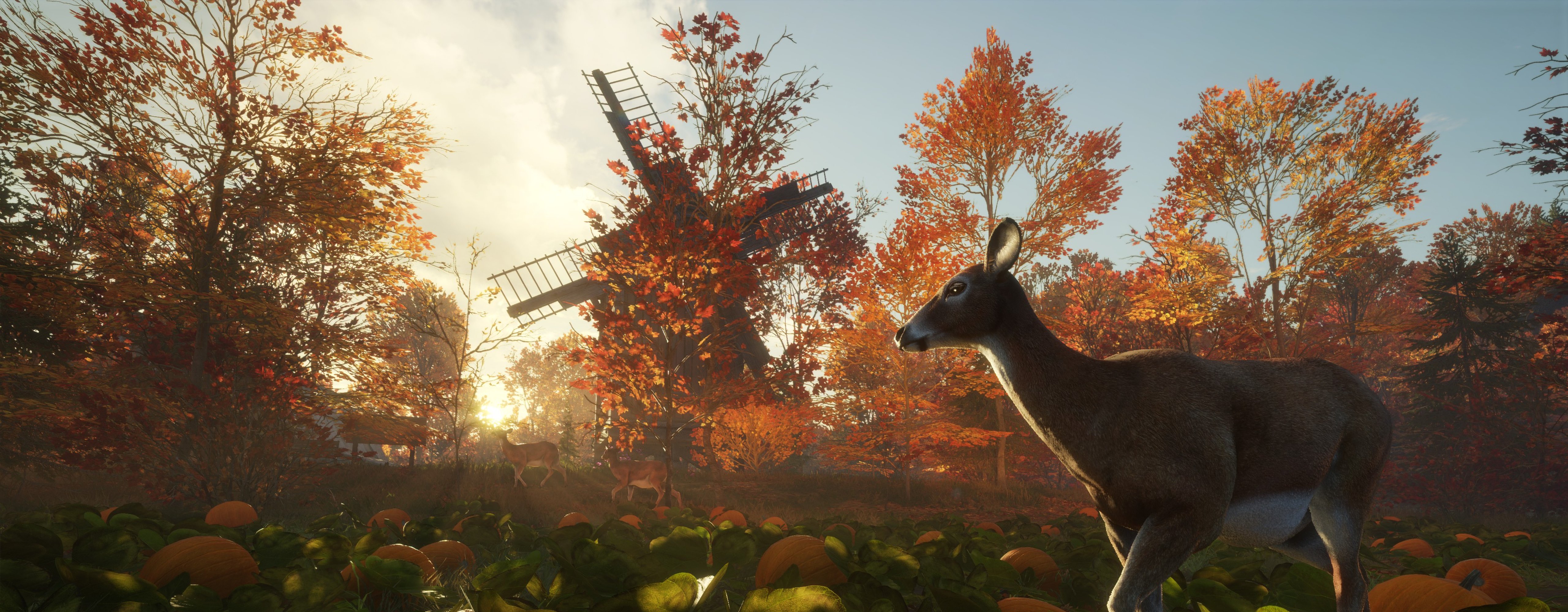 An image of a deer standing in front of a windmill as part of a post confirming the New England Mountains hotfix in theHunter Call of the Wild