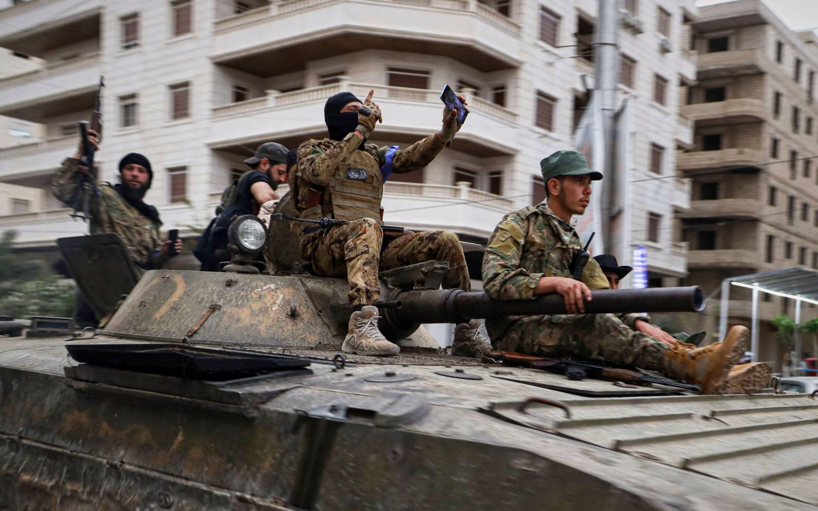 Members of Syria's security forces deploy in the town of Sahnaya.