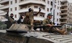 Members of Syria's security forces deploy in the town of Sahnaya.