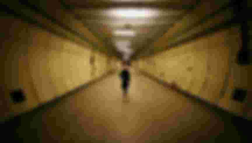 A visitor walks in a formely secret air raid tunnel called Third Avenue in London. The once secret tunnels were built 100 feet under central London in 1940 as fully equipped air raid shelters and could accommodate 8000 people. They have since been used by MI6 and the Public Records Office to hold 400 tonnes of secret documents. Credit: Peter Macdiarmid