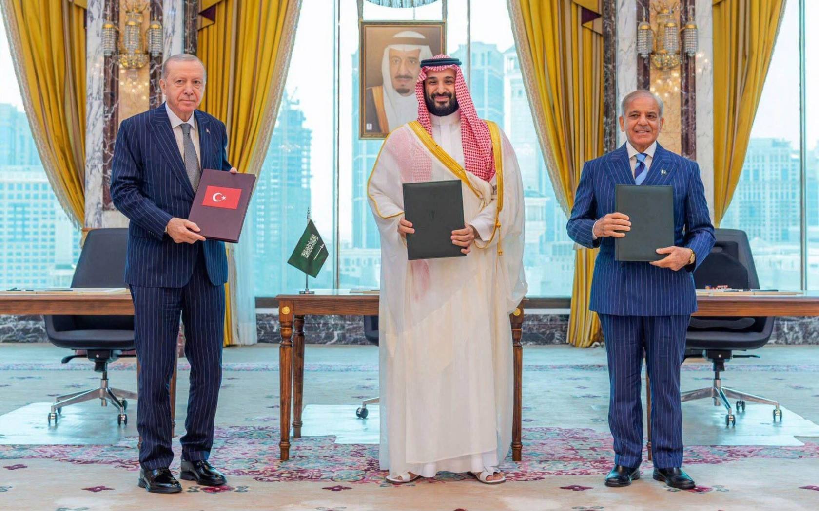 Saudi Crown Prince Mohammed bin Salman, Turkish President Recep Tayyip Erdogan, and Pakistani Prime Minister Shehbaz Sharif attend the signing ceremony of the Mecca Joint Defense Agreement in Mecca on August 7, 2026.