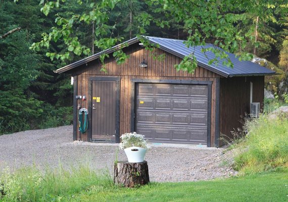 Garage door with adjacent pedestrian entrance