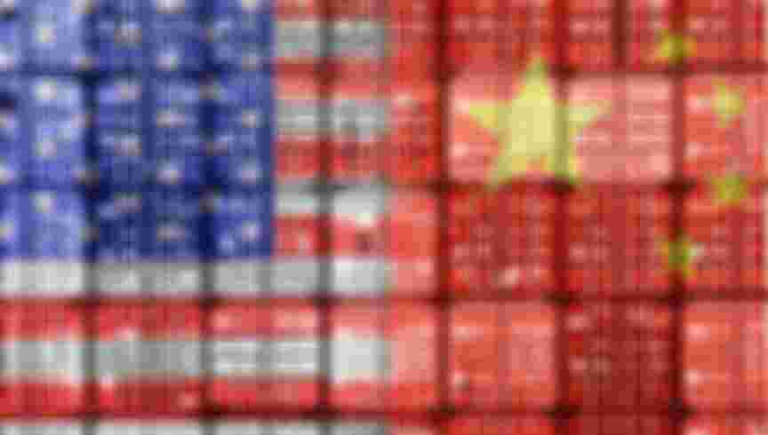 Flags of the USA and China on stacked containers. Credit: Christian Ohde / Alamy Stock Photo