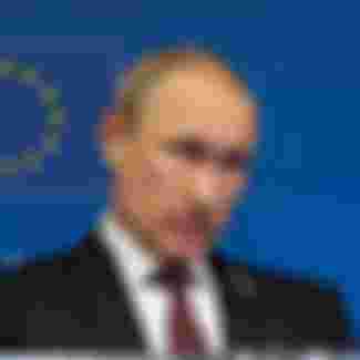 Vladimir Putin at an EU-Russia summit in Brussels