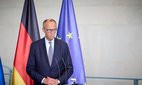 German Chancellor Friedrich Merz, listens to a question during a joint press conference with Ukrainian President Volodymyr Zelenskyy, in Berlin, Germany, 13 August 2025.