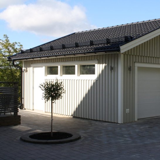 Large custom sun blasted double garage door solution