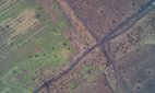 An artillery-cratered crossroads in Donbas.
