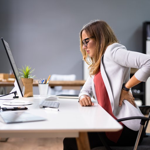 Back,Pain,Bad,Posture,Woman,Sitting,In,Office