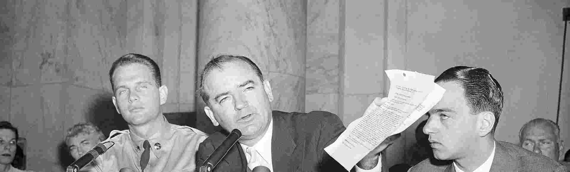 Senator Joseph McCarthy with G. David Schine (left) and Roy Cohn (right) at a session of the McCarthy-Army dispute hearing on June, 7, 1954.