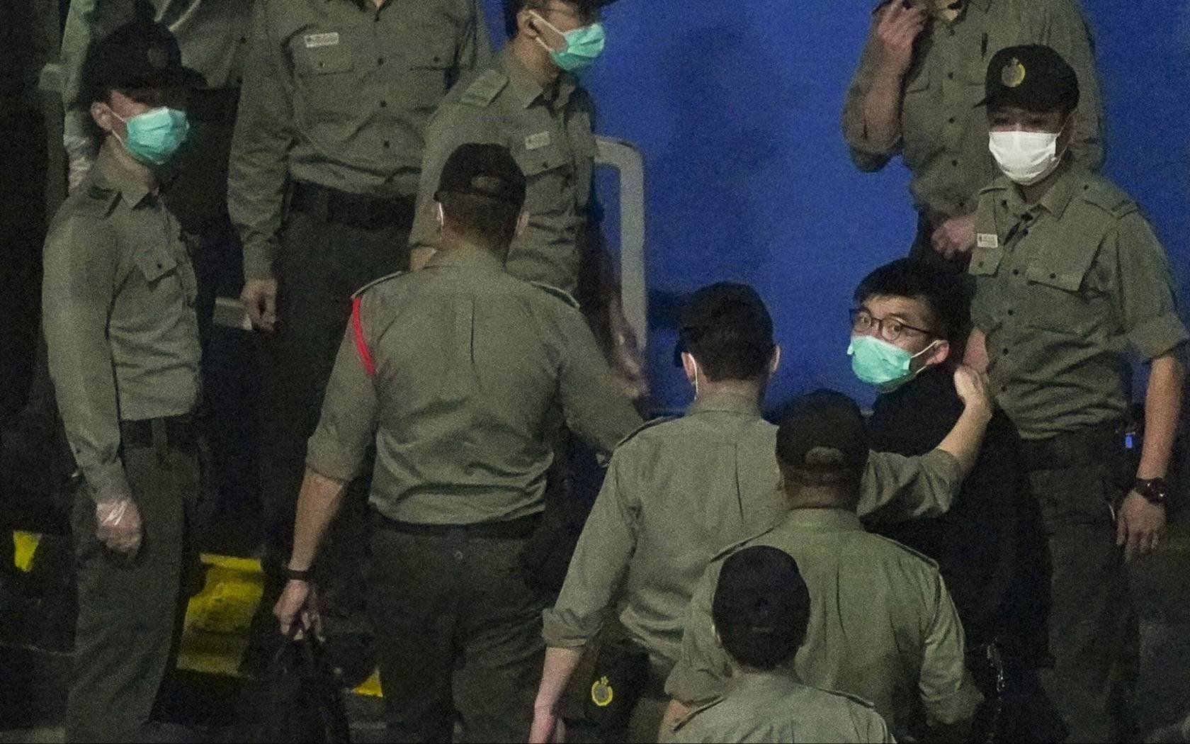 Pro-democracy activist Joshua Wong in custody in 2021.