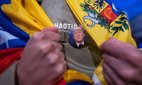 A Venezuelan living in Madrid celebrates the arrest of Nicolas Maduro at a gathering in Puerta del Sol. Credit: Marcos del Mazo