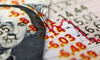 A US dollar bill next to declining economic figures.
