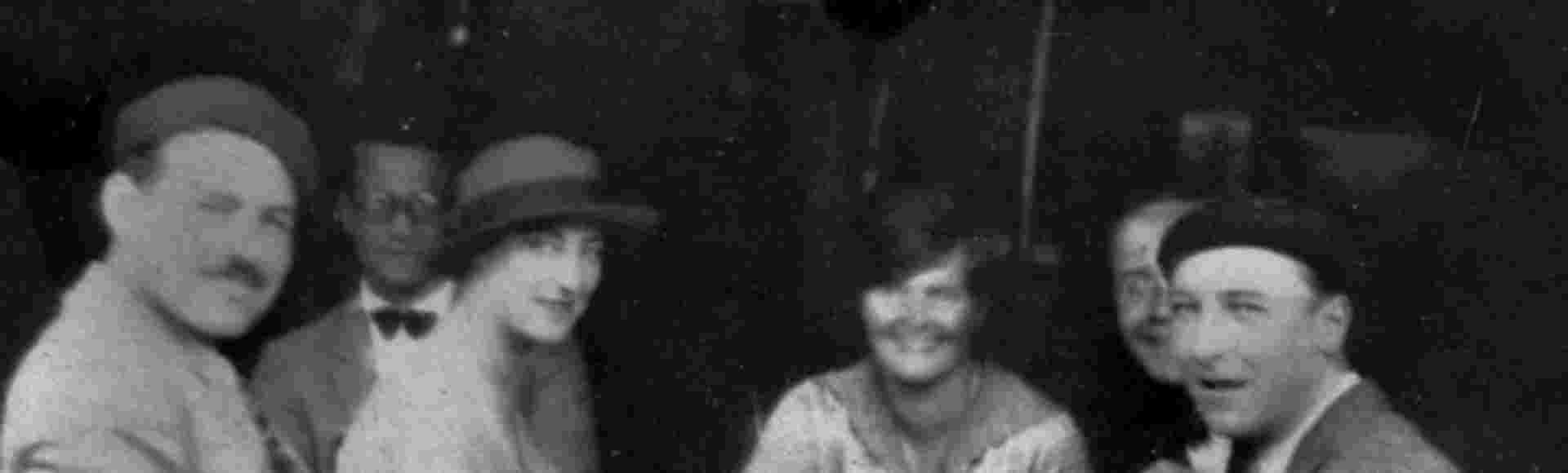 Ernest Hemingway, Harold Loeb, Duff Twysden, Hadley Hemingway, Donald Ogden Stewart (partly hidden) and Pat Guthrie at a café in Pamplona, July 1925.