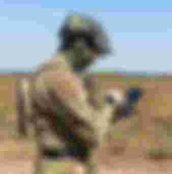 Soldier flying a drone