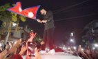 Nepal's new Prime Minister Balendra Shah waves the national flag in Jhapa, Nepal. Credit: ZUMA Press.