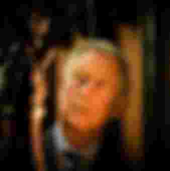 King Charles III views a wooden carving at St. Laurence's Church in Ludlow, Shropshire.