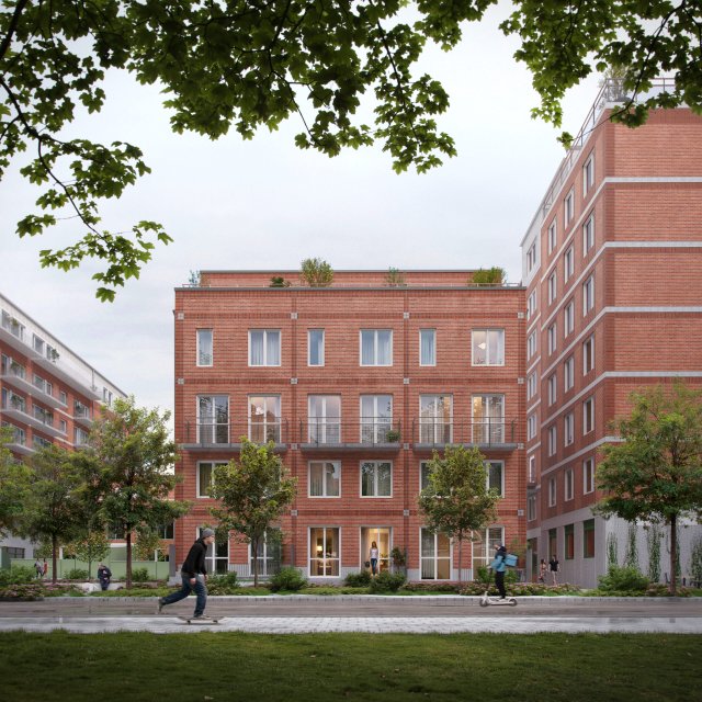 L&auml;genhetshus med tegelfasad i bostadsomr&aring;de.