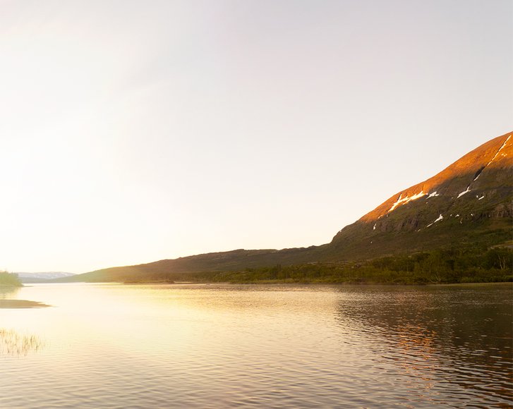 a lake in the midnight sun