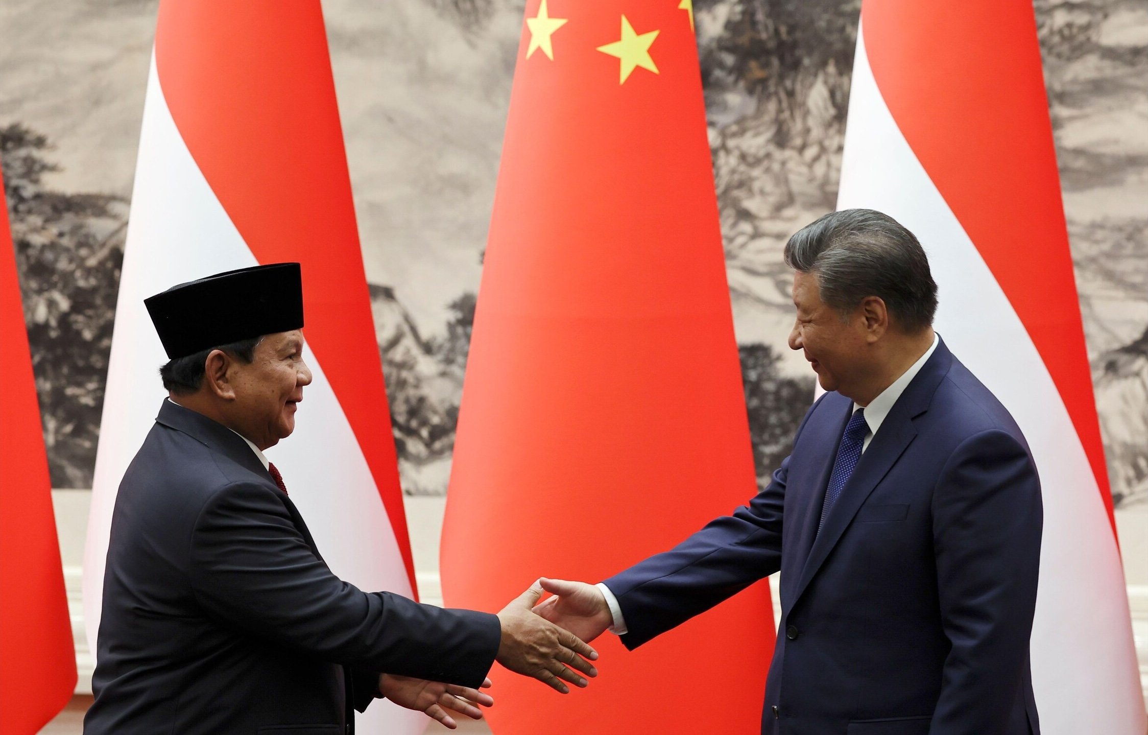 Chinese President Xi Jinping, right, and Indonesian President Prabowo Subianto shake hands during their meeting at the Great Hall of the People, in Beijing, Saturday, Nov. 9, 2024. Associated Press / Alamy Stock Photo