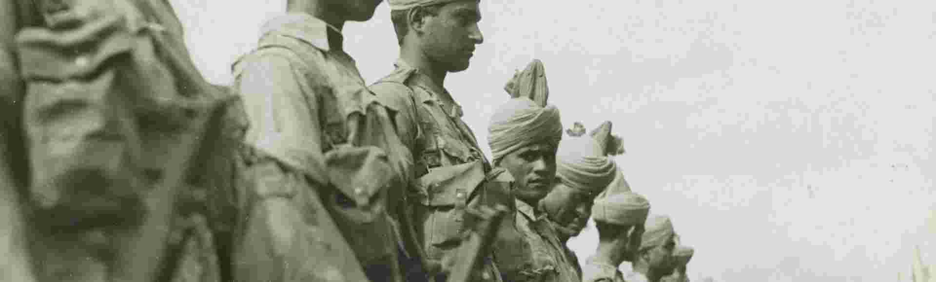 Newly arrived British Indian soldiers stand at attention prior to inspection at Singapore in December 1941.