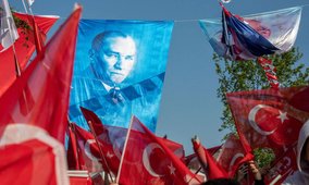 Republican People's Party (CHP) supporters waving an Atatürk flag at an Ekrem Imamoglu rally held in Istanbul on 25 May 2023.