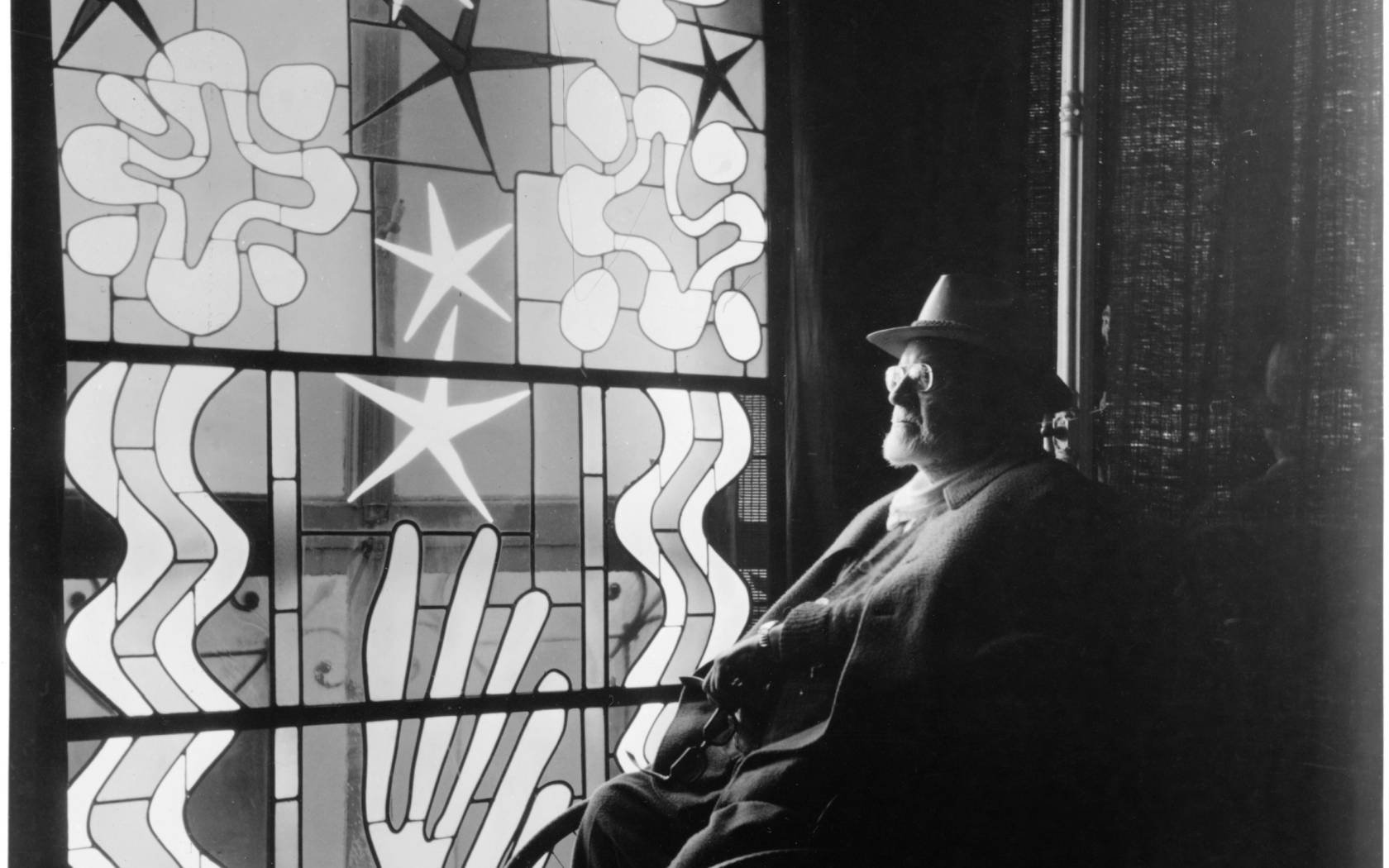 Henri Matisse (1869-1954) looking at stained glass at the Chapel of the Rosary, Vence.
