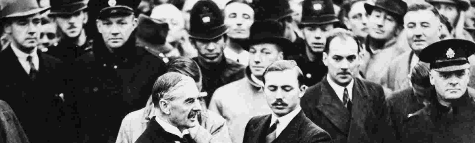 Neville Chamberlain arrives at Heston Aerodrome, London after meeting Adolf Hitler.