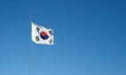 Flag of South Korea against a blue sky.
