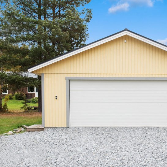 Cream finish double wide garage port