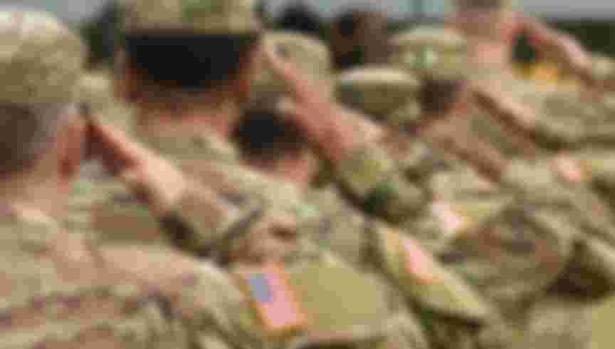 US troops salute. Credit: Bumble Dee / Alamy Stock Photo.