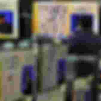 TV screens showing the live broadcast of the Google DeepMind Challenge Match at Yongsan Electronic Technology Land in Seoul, South Korea.