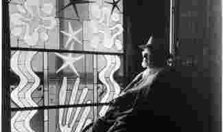 Henri Matisse (1869-1954) looking at stained glass at the Chapel of the Rosary, Vence.