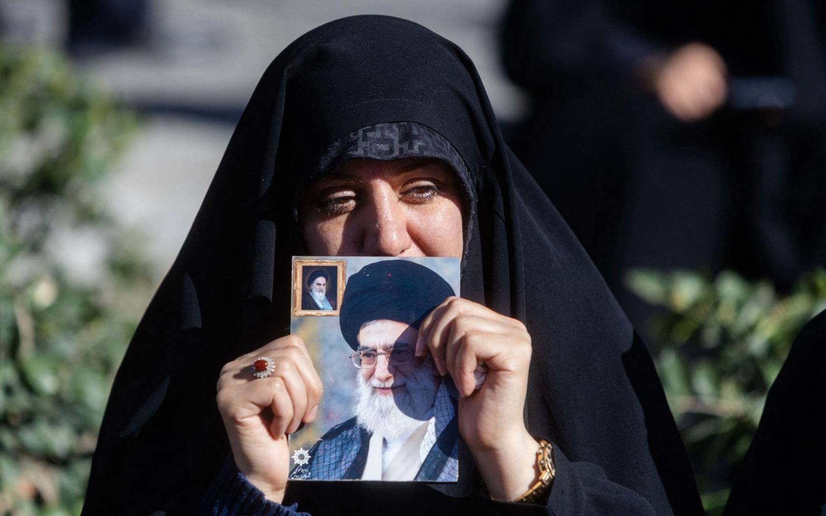 Supporters of the Islamic Republic of Iran gather in the streets on 1 March 2026 to mourn after reports of the killing of Supreme Leader Ali Khamenei.