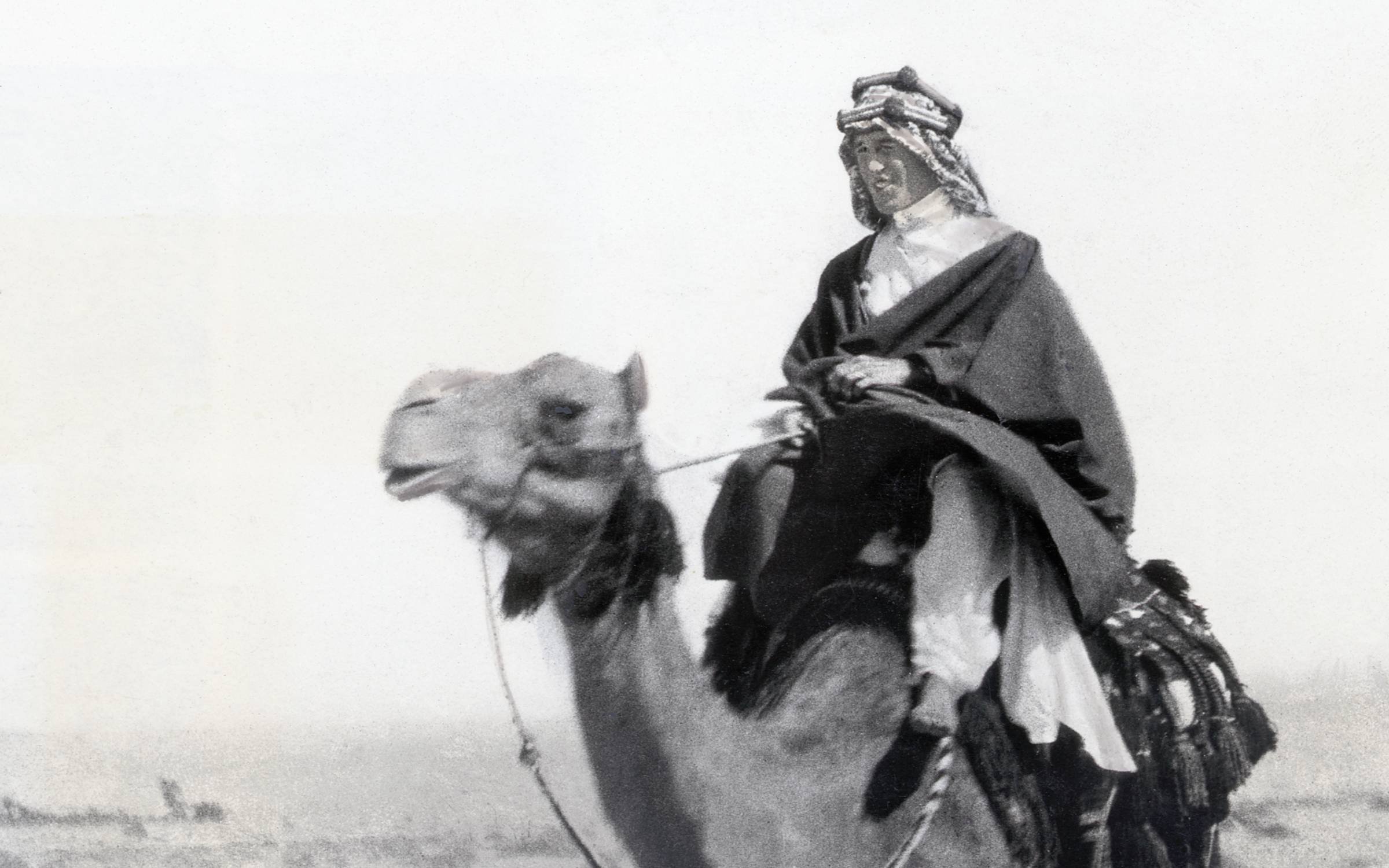 Thomas Edward (of Arabia) Lawrence riding a camel