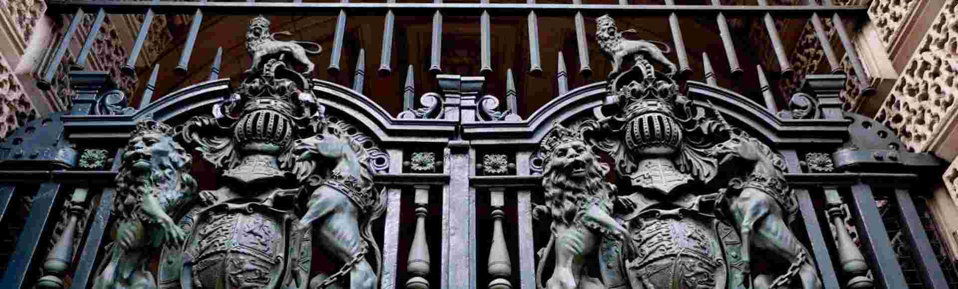Heraldic gates at an entrance to the Foreign, Commonwealth and Development Office in Whitehall. London, United Kingdom.