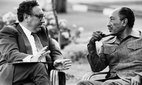 US Secretary of State Henry Kissinger and Egyptian President Anwar al-Sadat at a meeting in August 1975.
