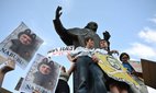 Demonstrators stay at the Taras Shevchenko monument to protest against draft law N12414 adopted on July 22, which reduces the powers of the National Anti-Corruption Bureau (NABU) and the Specialised Anti-Corruption Prosecutor’s Office (SAPO), Lviv, Ukraine, July 23, 2025.