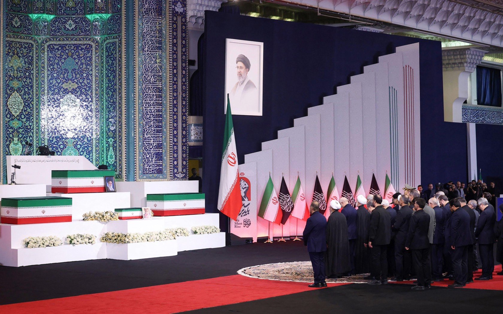 Foreign and domestic officials pay their respects before the coffins of the late Iranian Supreme Leader Ayatollah Ali Khamenei and members of his family in Tehran on 3 July. Credit: UPI