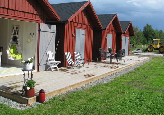 Four matching sheds with single entry and connected porch