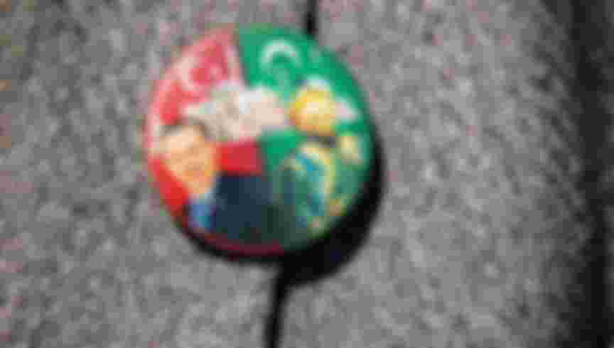 An attendee wears a badge depicting Recep Tayyip Erdogan, Turkey's president during the opening ceremony to mark the first day of prayers at the Hagia Sophia mosque. Credit: Kerem Uzel / Bloomberg via Getty Images.