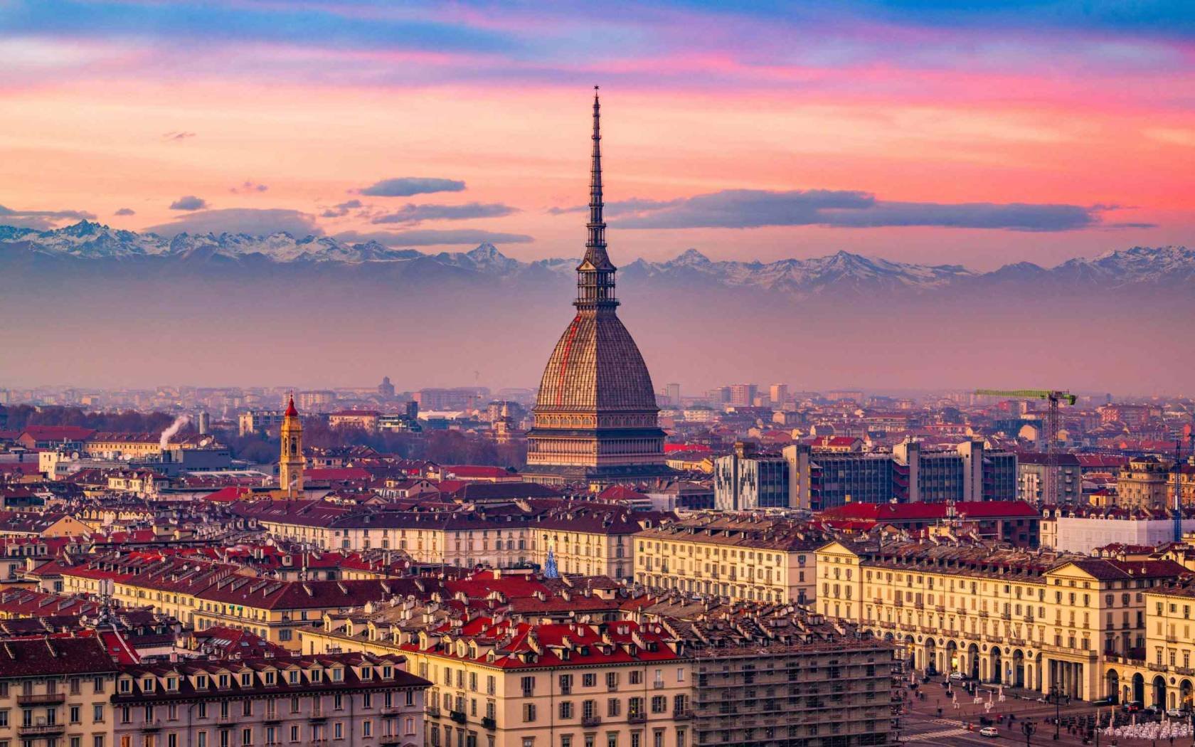 The skyline of Turin, Italy, at dusk.