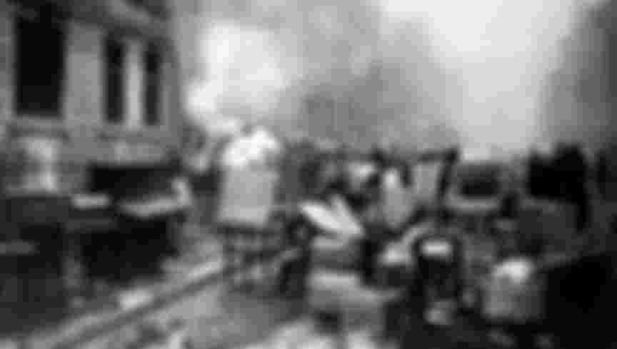 People try to save their belongings from their destroyed houses in the Marienstrasse (Marien street) after an airstrike during the Second World War in Hamburg, 25 October 1944. Credit: dpa picture alliance / Alamy Stock Photo