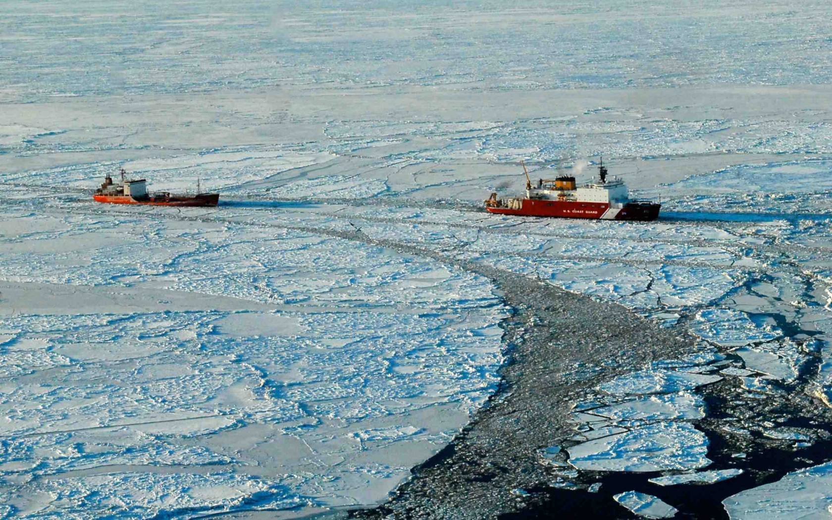 The US Coast Guard performs icebreaking operations in the Bering Sea.