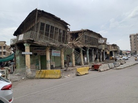Old Baghdad in distress: traditional brick and wood shops in Rashid Street. Author photograph.