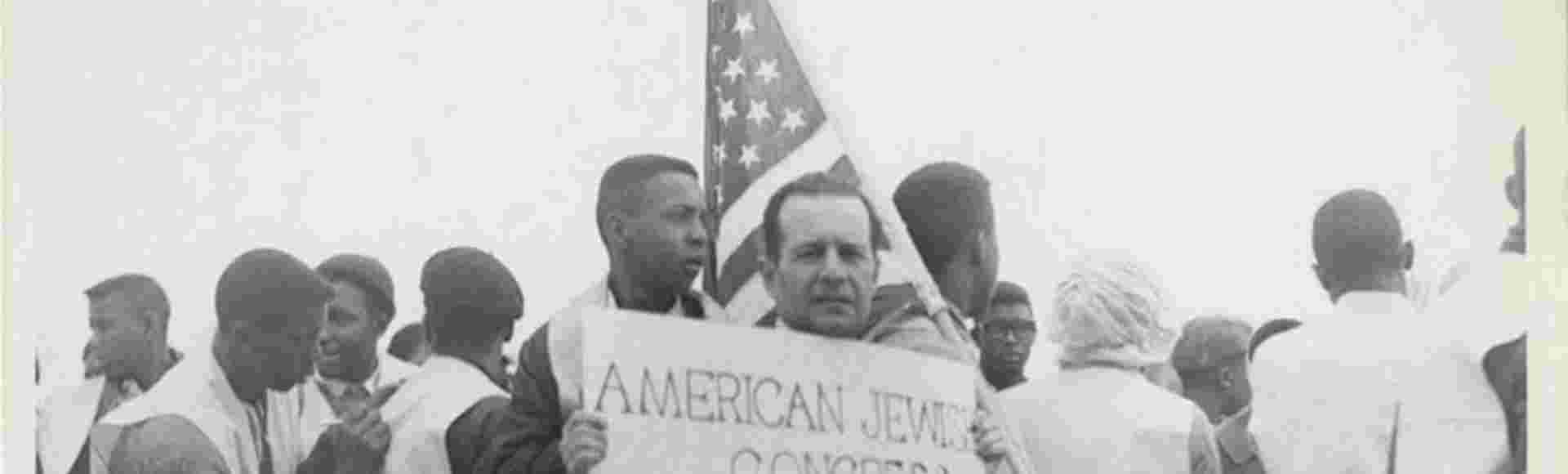 A member of the American Jewish Congress participating in the 1965 Montgomery March, advocating for civil rights.