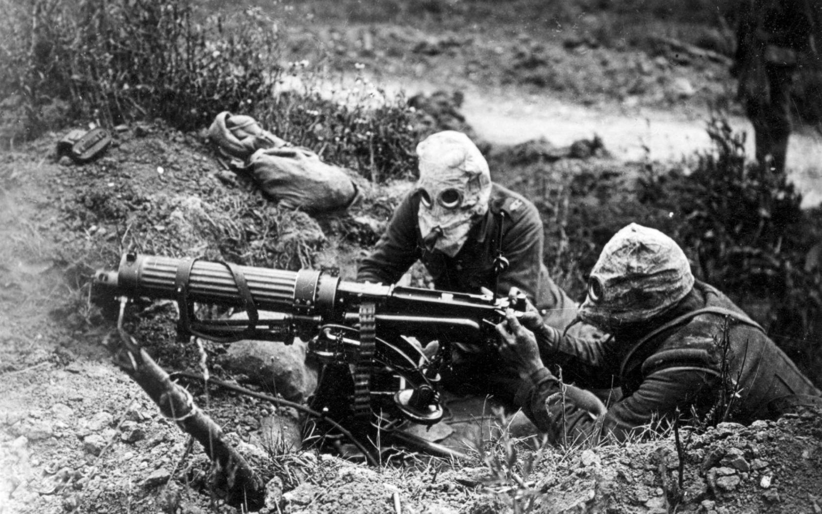 Two British machine gunners wearing gas masks in Battle of the Somme.