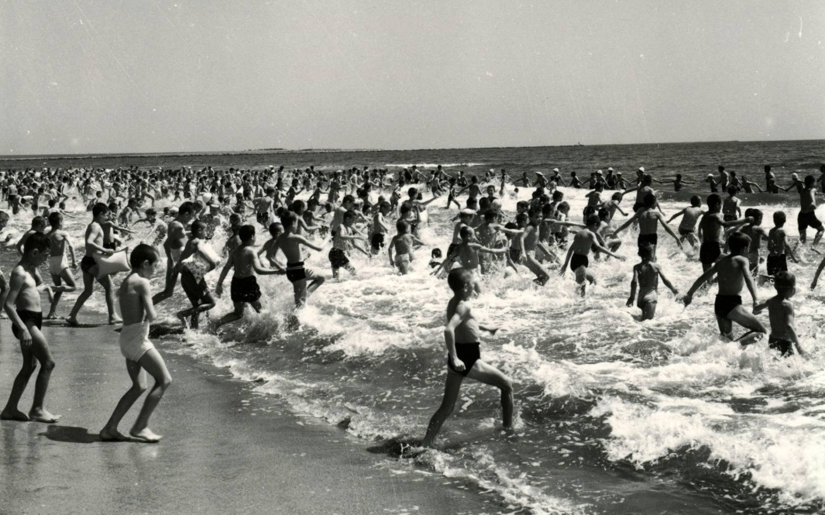 Tourists, pupils and pioneers staying at a holiday camp on the Black Sea, Navodari, Romania in the 1960s.