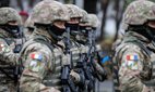 Romanian army soldiers at the Romanian National Day military parade. Credit: MoiraM / Alamy Stock Photo.