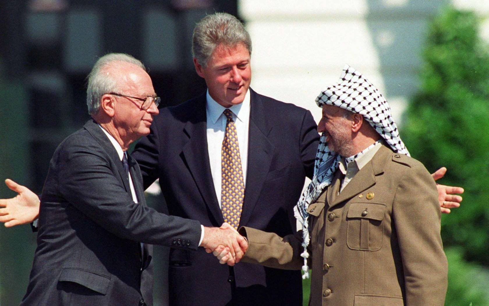 Yitzhak Rabin shakes hands with Yasser Arafat on the South Lawn of the White House following the signing of the Oslo Accords in 1993.